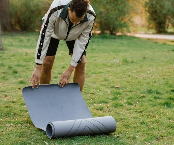 Man meditating before a workout, symbolizing mental preparation and focus.